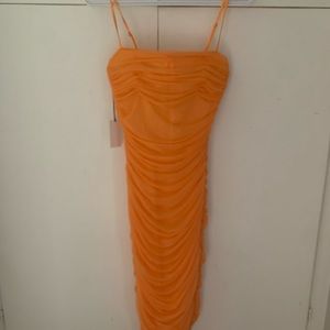 Brand new, with tags. Only tried on at home.